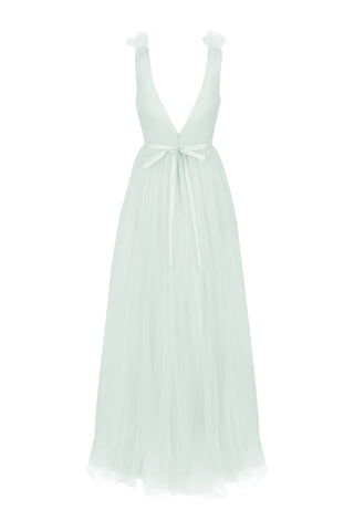 Light green dress with tulle straps  and bow at back, low v back detail on a white background by TH&TH bridesmaids.