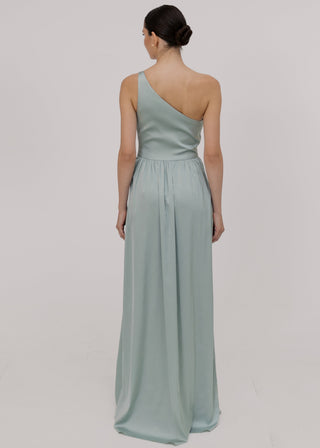 Woman wearing a green bridesmaid dress with one shoulder detail back view by TH&TH bridesmaids.