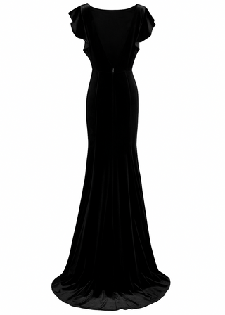 Woman wearing a long black bridesmaid dress with flutter sleeves and high neck in velvet.