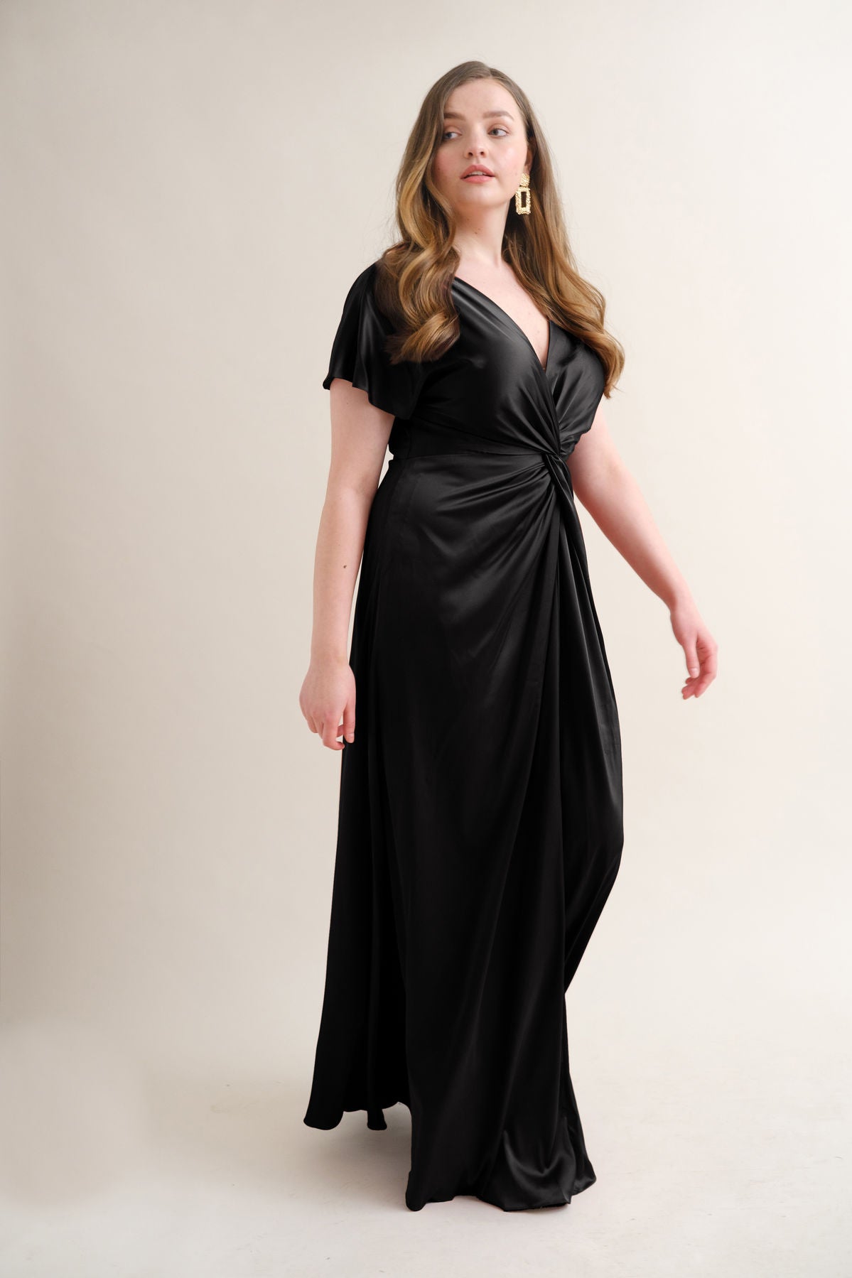 Plus size bridesmaid wearing black twist knot black satin bridesmaid dress