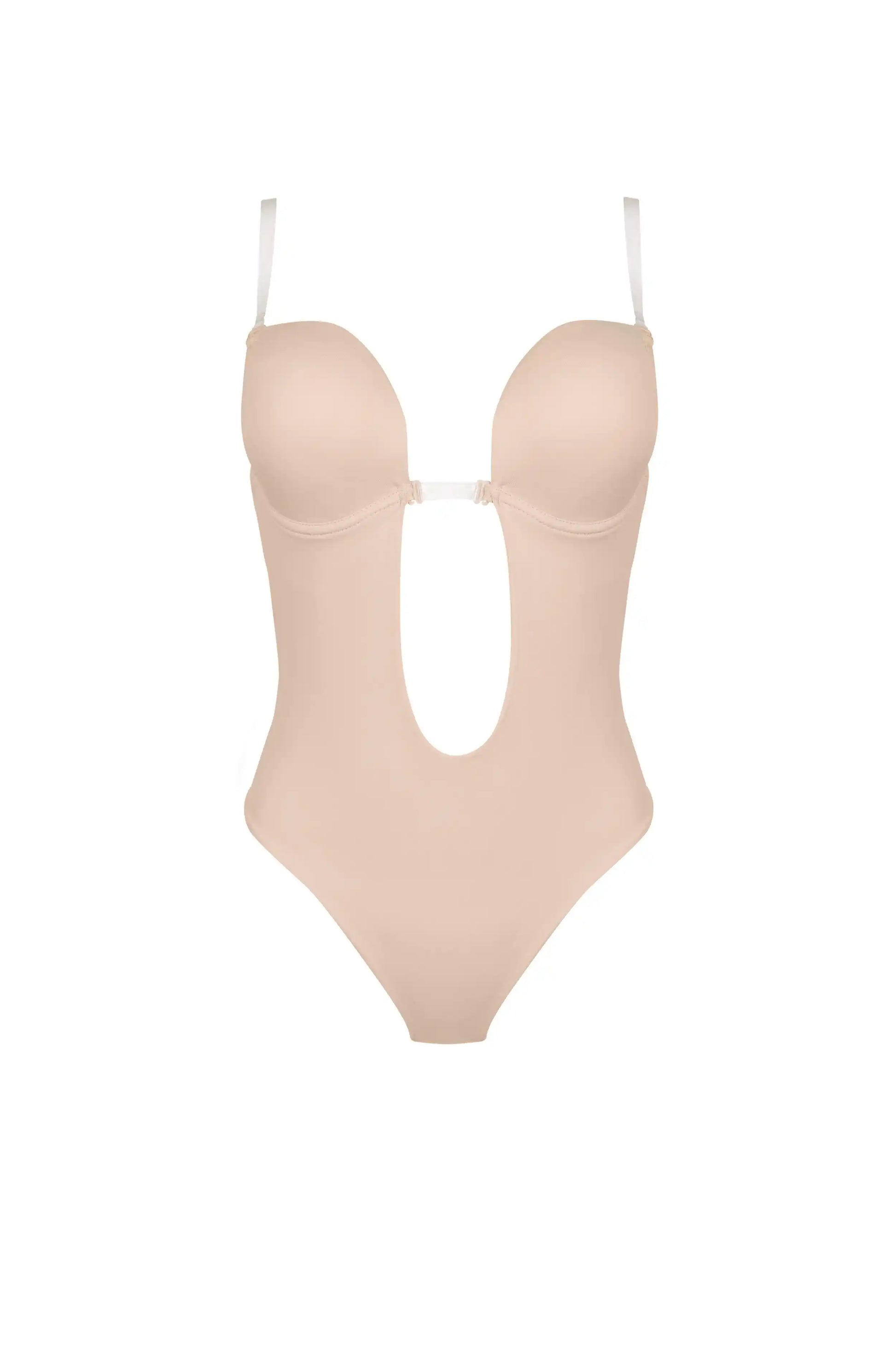 The TH & TH Backless Bodysuit In Cream Peach features molded cups, underwire support for lift, thin adjustable straps, a thong cut, and a large U-shaped cutout at the front and midsection. Shown against a plain white background.