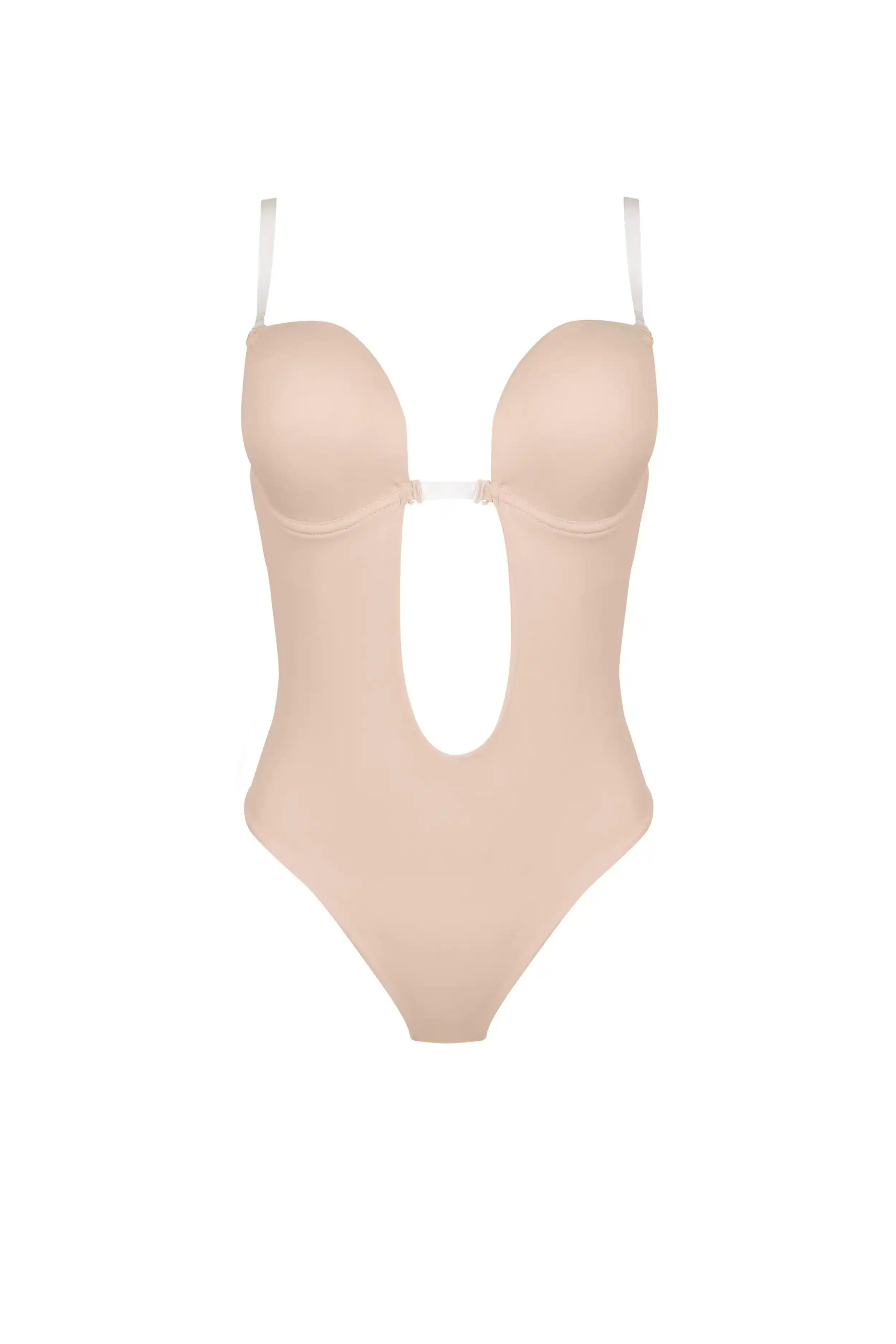 The TH & TH Backless Bodysuit In Cream Peach features molded cups, underwire support for lift, thin adjustable straps, a thong cut, and a large U-shaped cutout at the front and midsection. Shown against a plain white background.