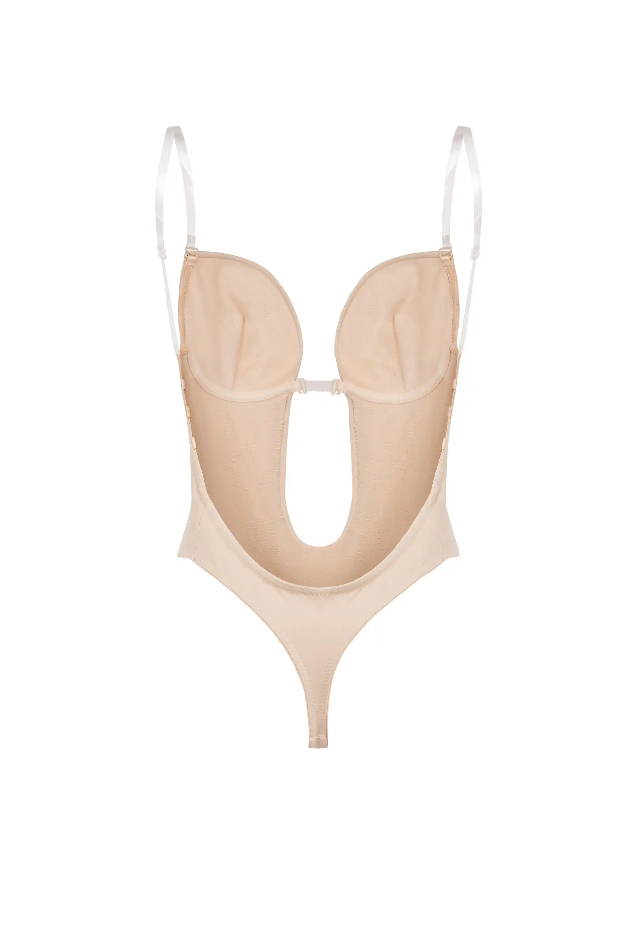 The TH & TH Backless Bodysuit In Cream Peach features a thong cut, underwire cups, adjustable white straps, and a large front cutout, shown against a white background.