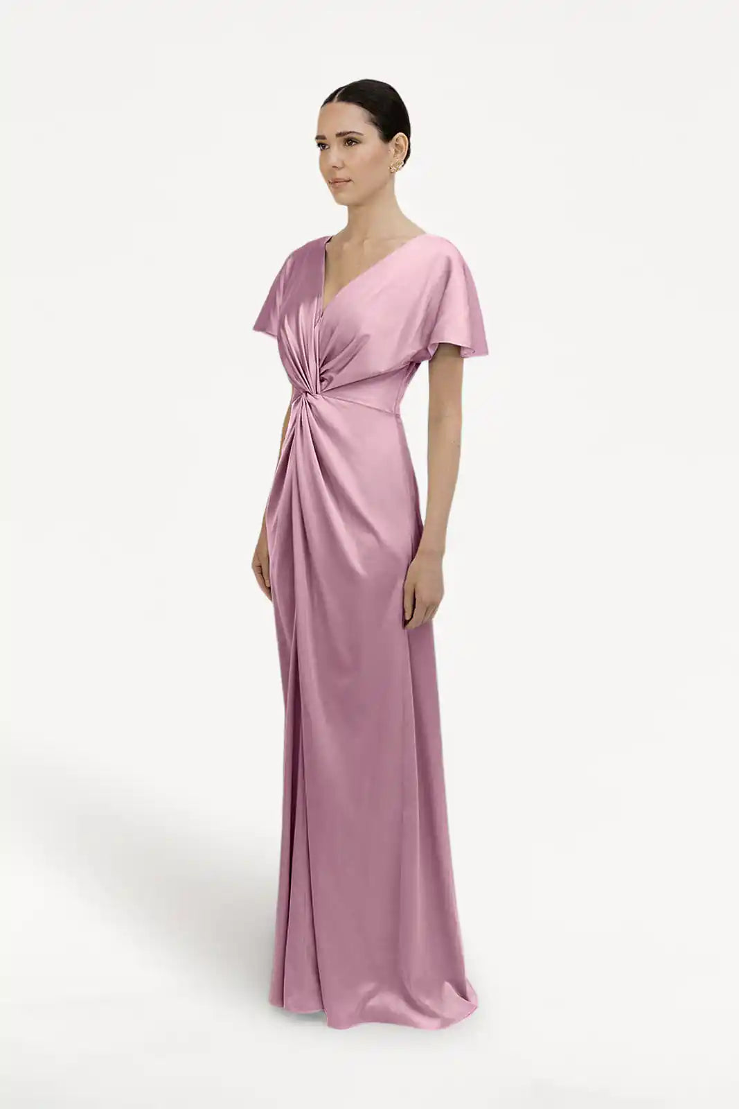 A woman wears the TH&TH Camilla Bridesmaid Dress in rose pink satin, featuring short butterfly sleeves, a V-neckline, and a twist-knot waist bodice. She stands against a plain white background.