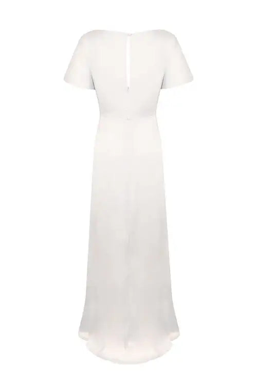 The Camilla Dress in Ivory Satin by TH & TH is shown from the back, featuring a floor-length hemline, subtle keyhole opening, and smooth, flowing fabric for a timeless look.