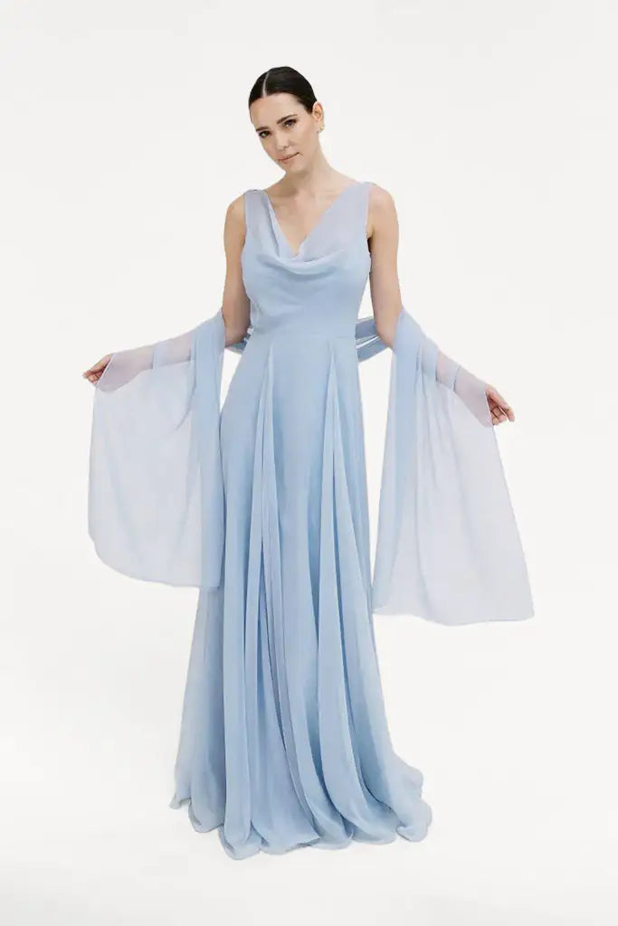 A woman models the TH&TH Chiffon Shawl, paired with a long, flowing light blue gown featuring a draped neckline—an elegant look for bridal party or bridesmaid dresses, set against a plain white background.