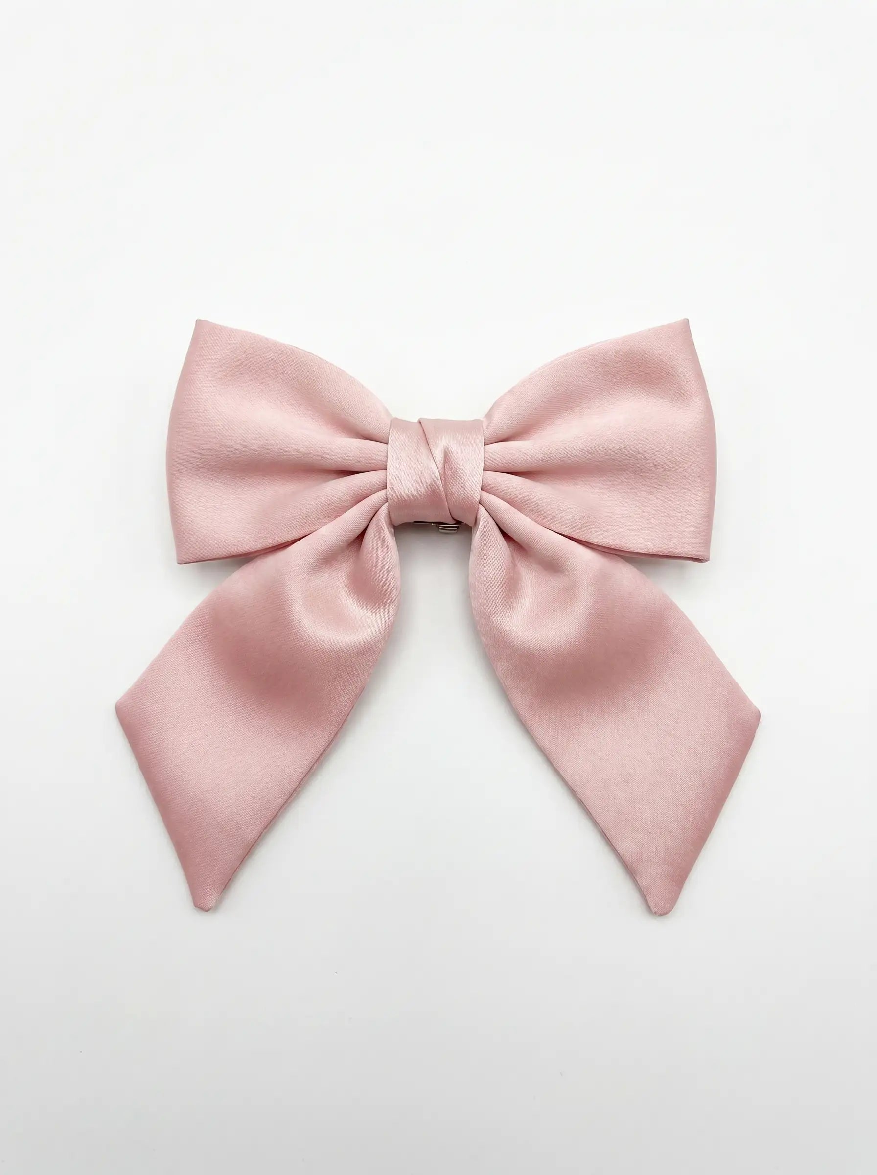 Pink bow on a light gray background