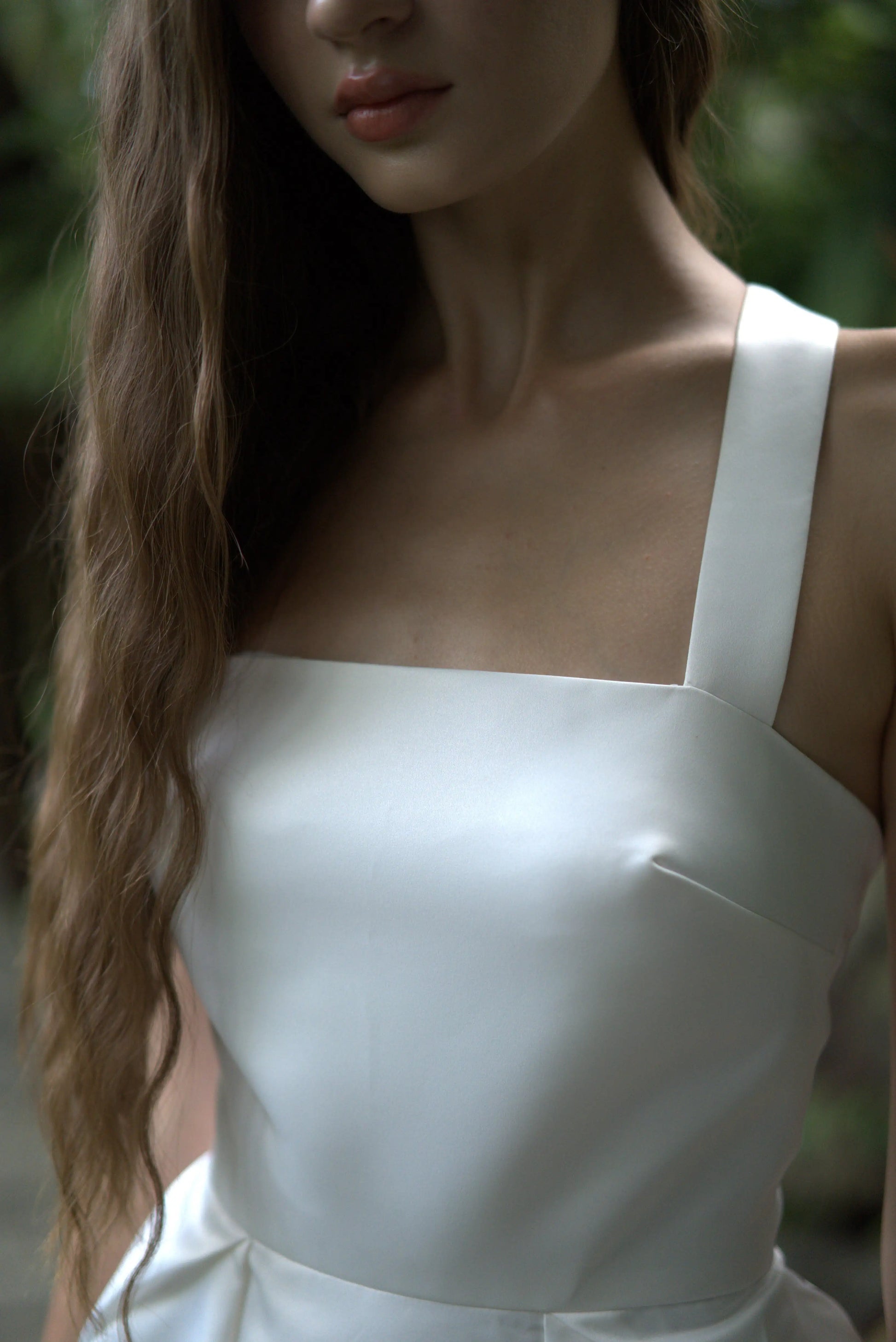 Woman wearing white bridal gown close up