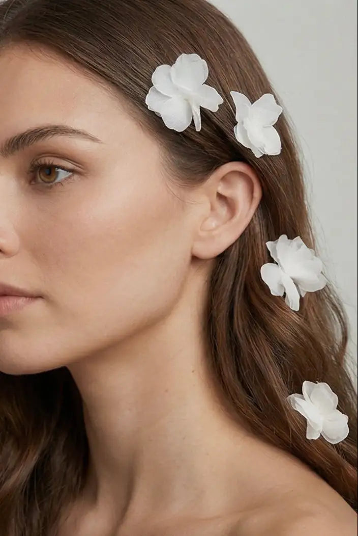 A woman with long brown hair wears TH&TH Petal Hair Pins 3pcs arranged along the side of her head, posing against a light background with a neutral expression.