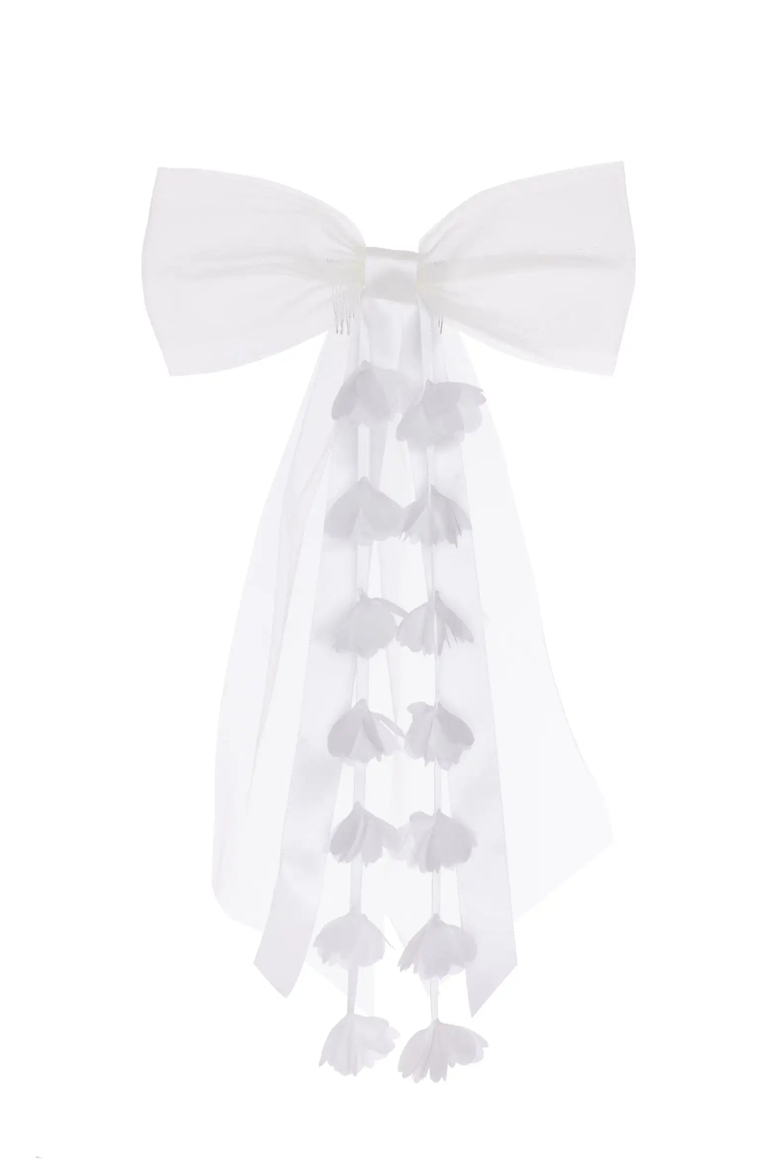 The Posey Tulle Hair Bow by TH&TH is a large white bow with long trailing ribbons finished with delicate flower details, making it a perfect wedding hair accessory. Shown here against a plain white background.