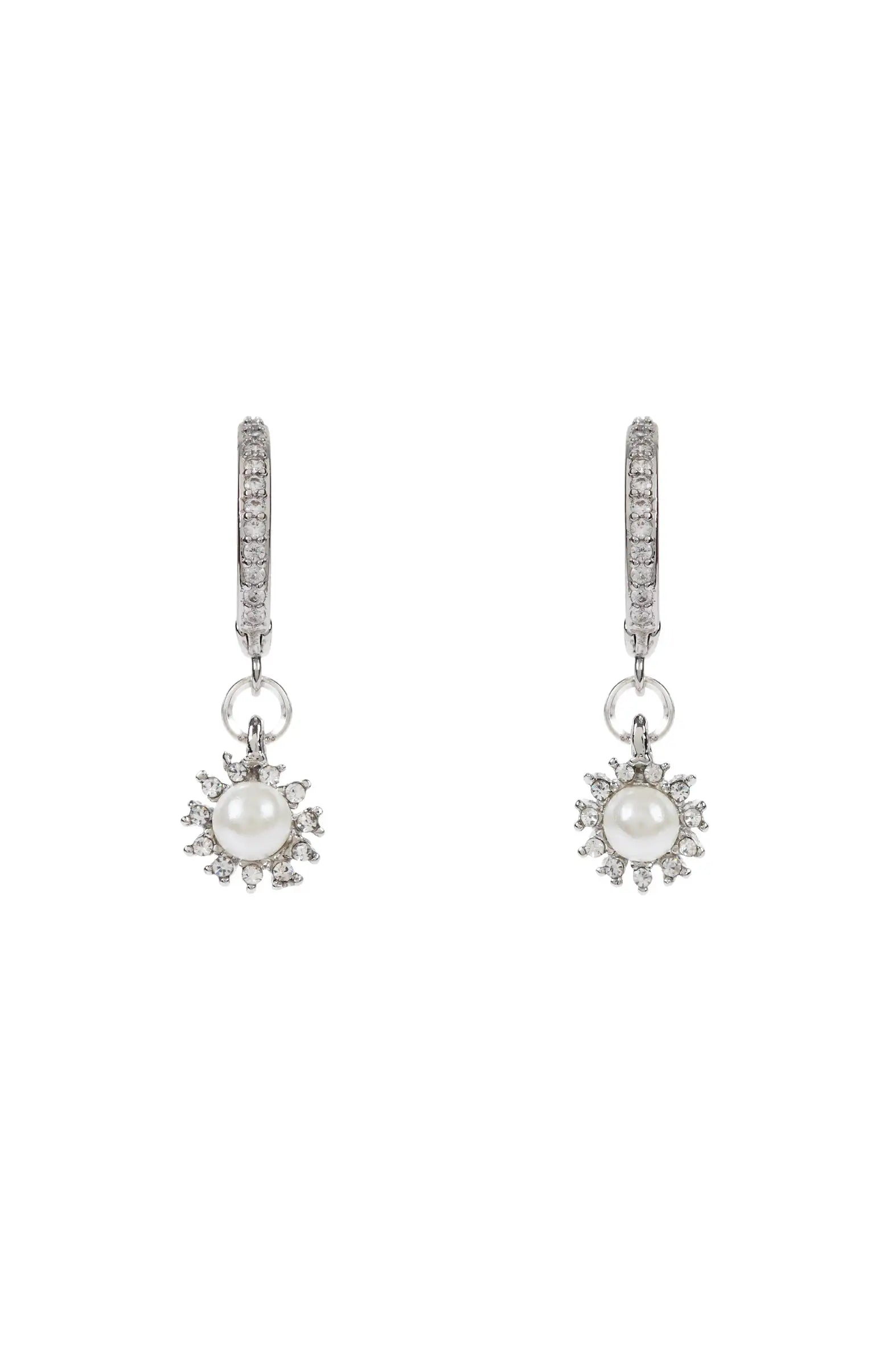 The Regent Hoop Earrings with Crystal and Pearl Drop in Silver by TH&TH feature hoop earrings adorned with small diamonds and sunburst-shaped pendants with central white pearls—an elegant bridal or wedding jewellery choice.