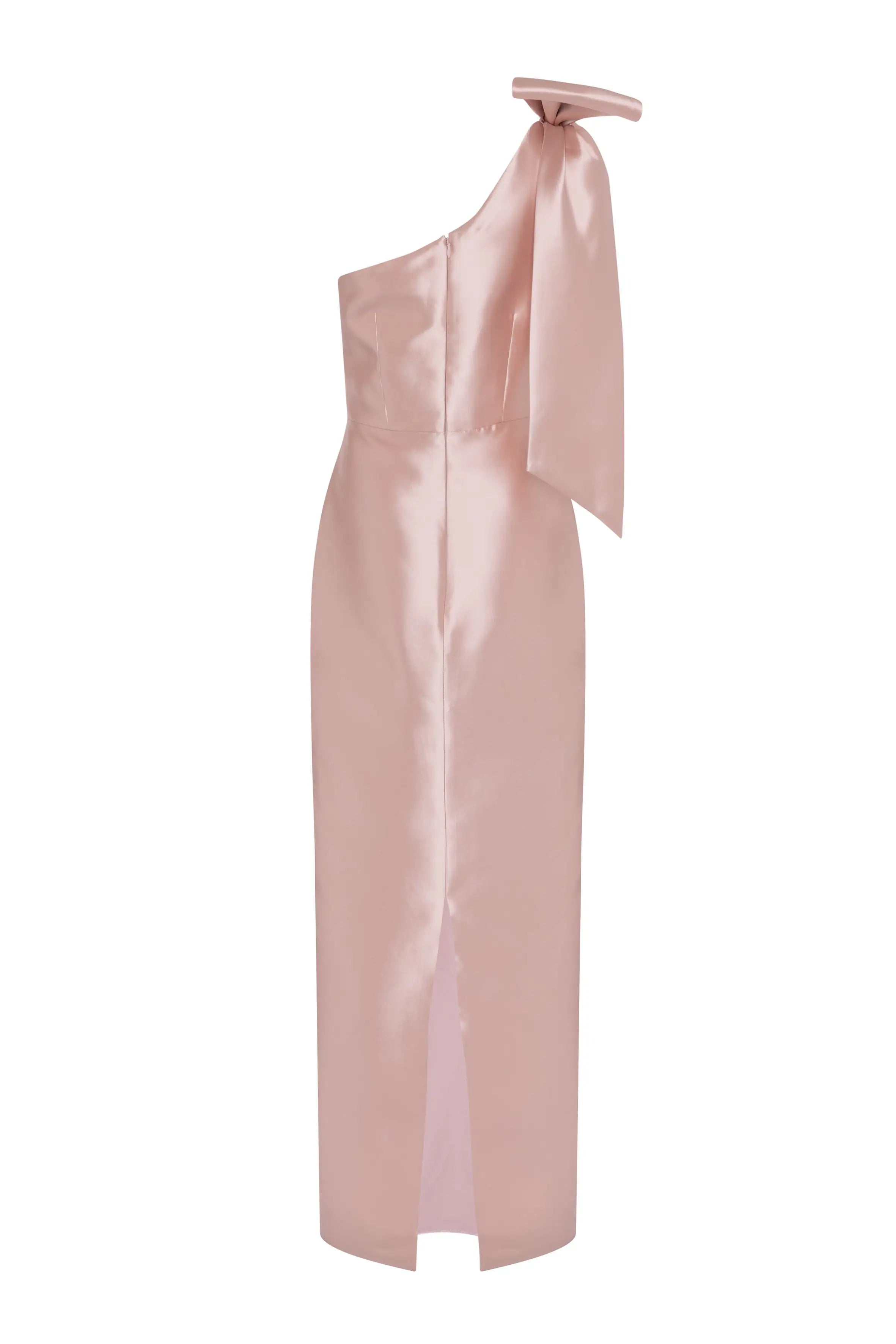 The TH&TH Ritz Bridesmaid Dress in blush pink satin twill features a one-shoulder design with a statement shoulder bow, fitted silhouette, and a front hem slit.