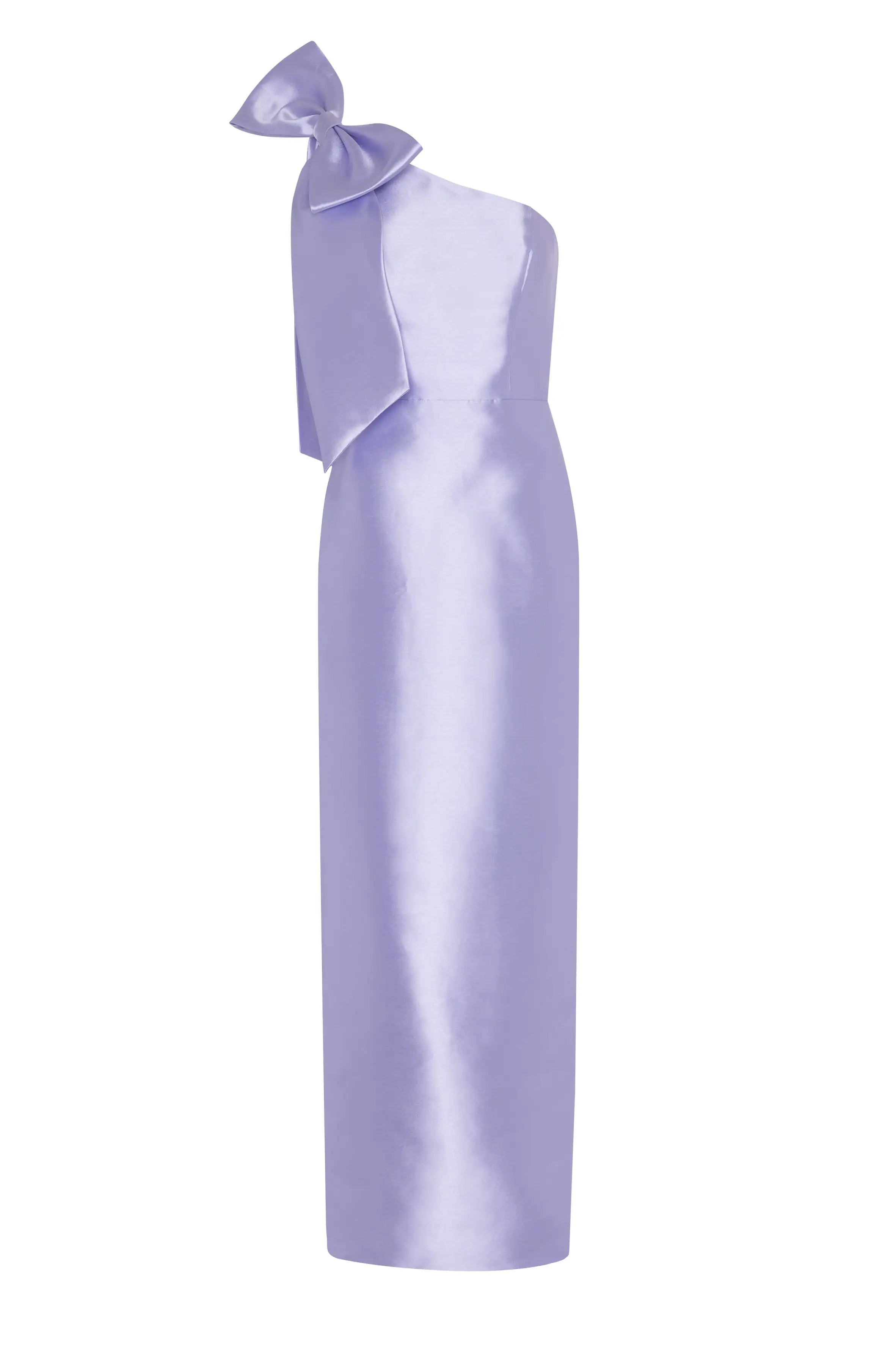 The TH&TH Ritz Bridesmaid Dress in Lilac Mist Satin Twill is a shiny, floor-length gown with a one-shoulder design, statement bow detail, and flattering fitted silhouette.