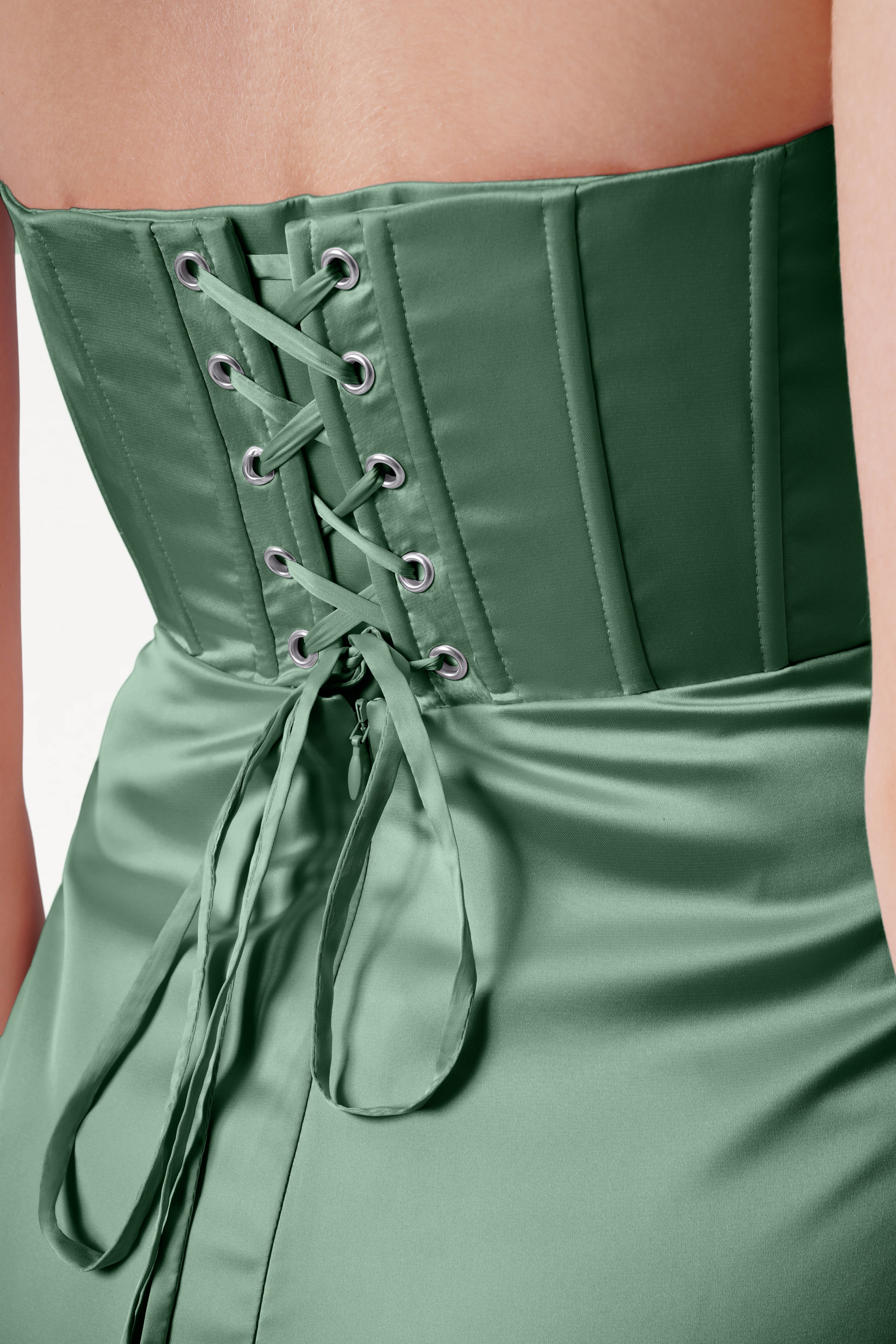 Green corset-style dress with lace-up back on a plain background