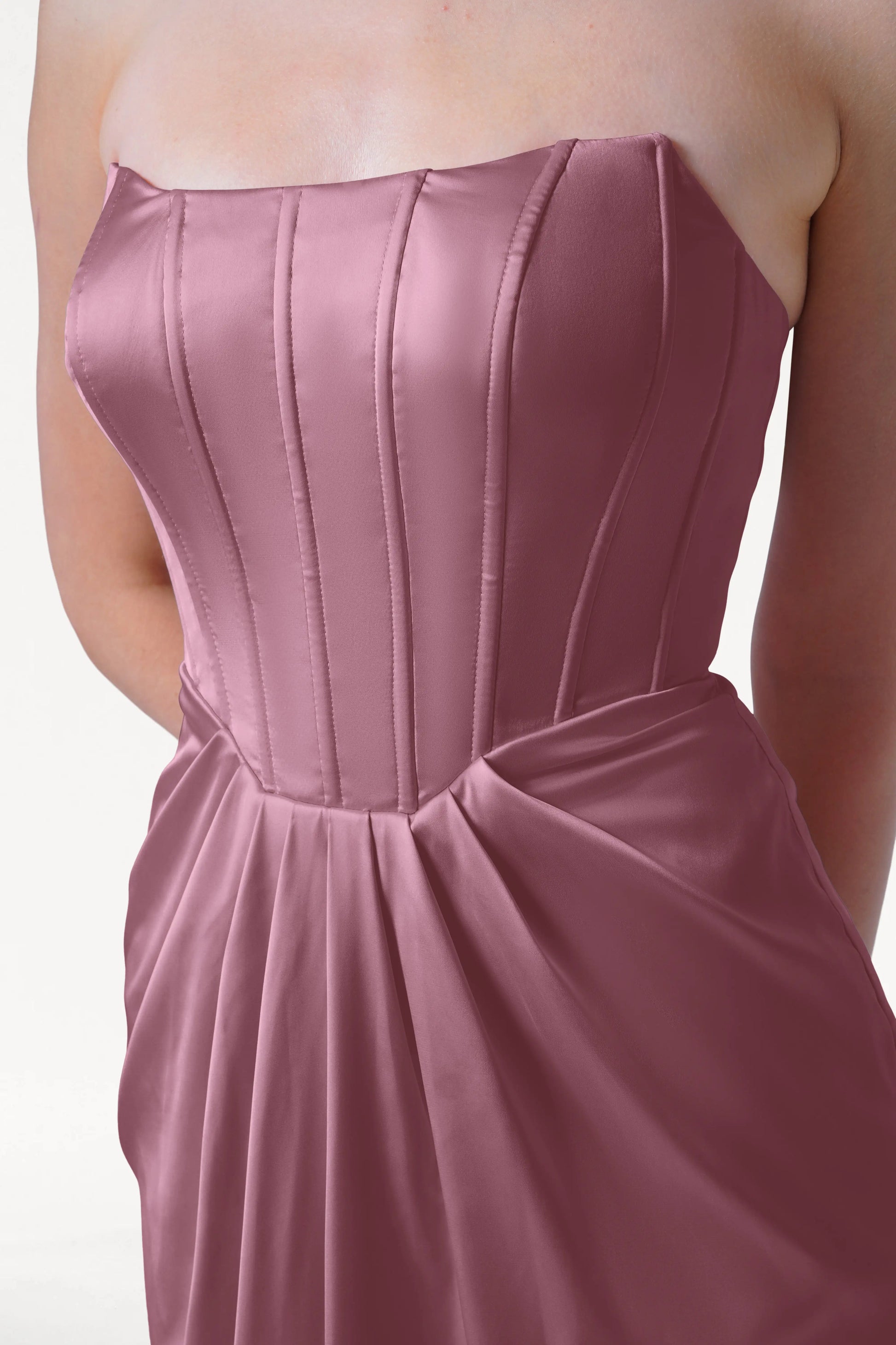 Rose pink strapless gown on a white background