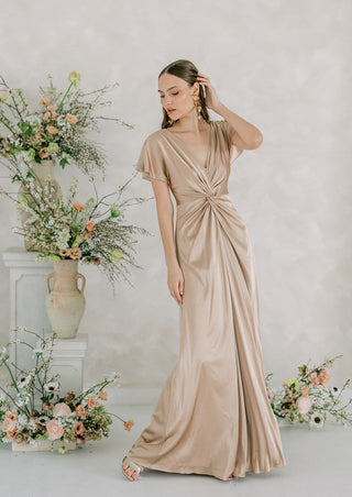 Champagne satin maxi bridesmaid dress with twist knit front detail and sleeves.