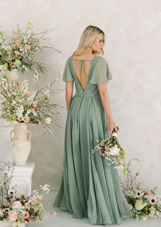 Sage green chiffon maxi bridesmaids dress with flutter sleeves and full skirt.