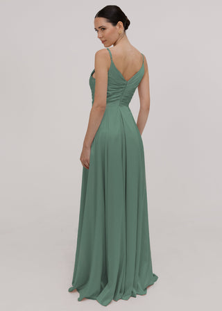 Model wearing a floor length sage green bridesmaid dress with V back and spaghetti straps by TH&TH 