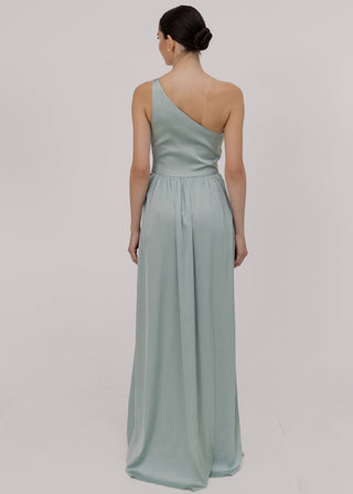 Woman wearing a green bridesmaid dress with one shoulder detail back view by TH&TH bridesmaids.