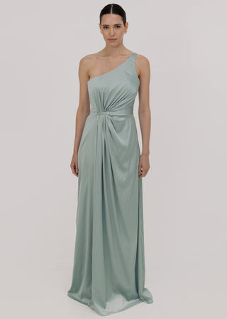 Woman wearing a green bridesmaid dress with one shoulder detail, front view by TH&TH.