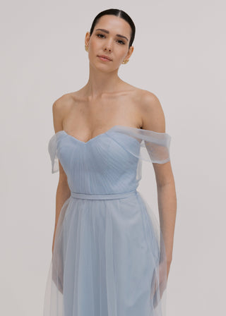 A dusty blue tulle bridesmaid dress with bardot sleeves by TH&TH Bridesmaids.
