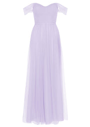 A lilac tulle bridesmaid dress with bardot sleeves by TH&TH Bridesmaids. 
