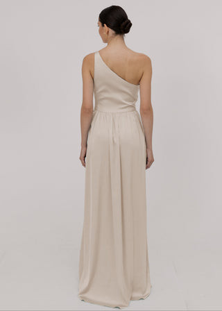 Woman wearing an oyster one-shoulder bridesmaid dress by TH&TH.