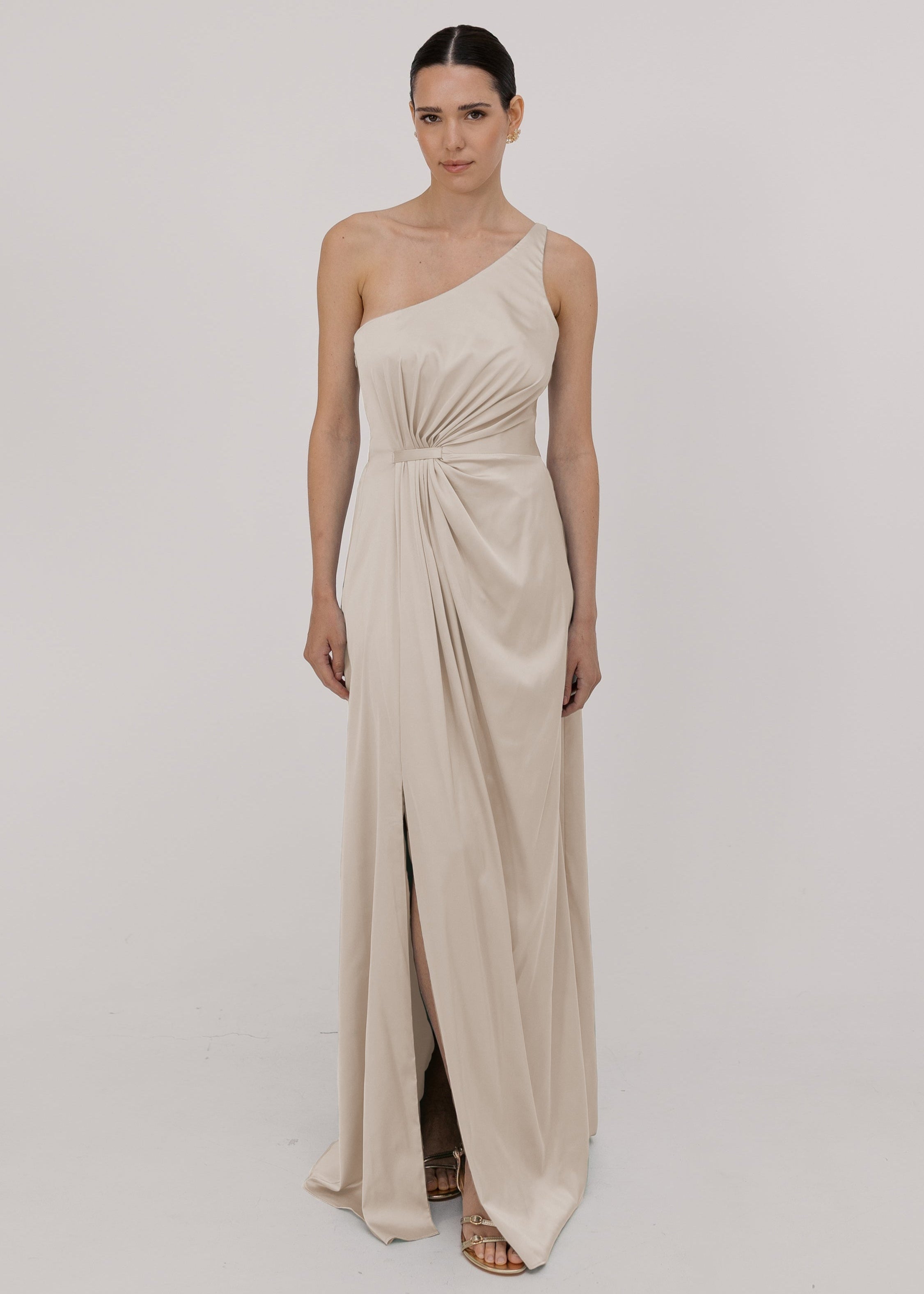 Woman wearing a one-shoulder oyster bridesmaid dress by TH&TH.