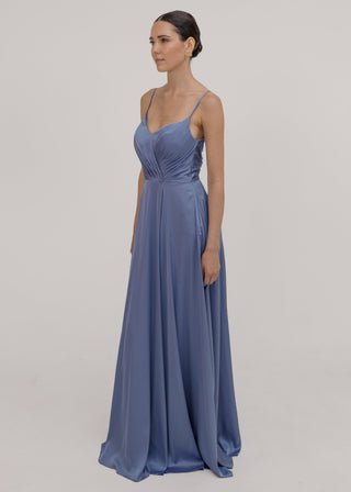 Woman wearing a long blue bridesmaid dress with cami bodice, V neck and a line skirt in french blue satin.