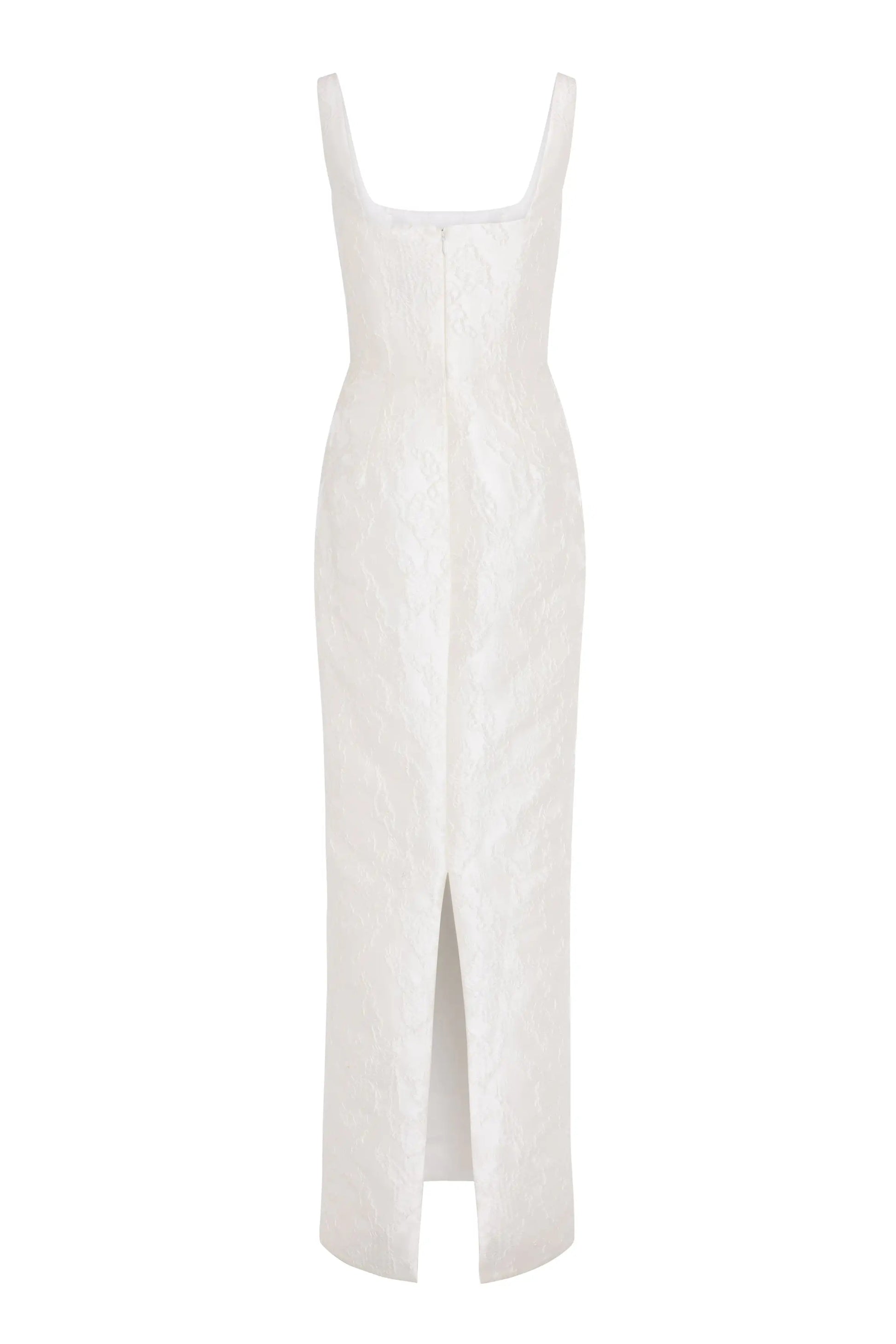 The Waldorf Bridal Dress in Vintage Ivory Brocade by TH&TH is a sleeveless, floor-length column gown with a square neckline, textured floral pattern, and front hem slit.