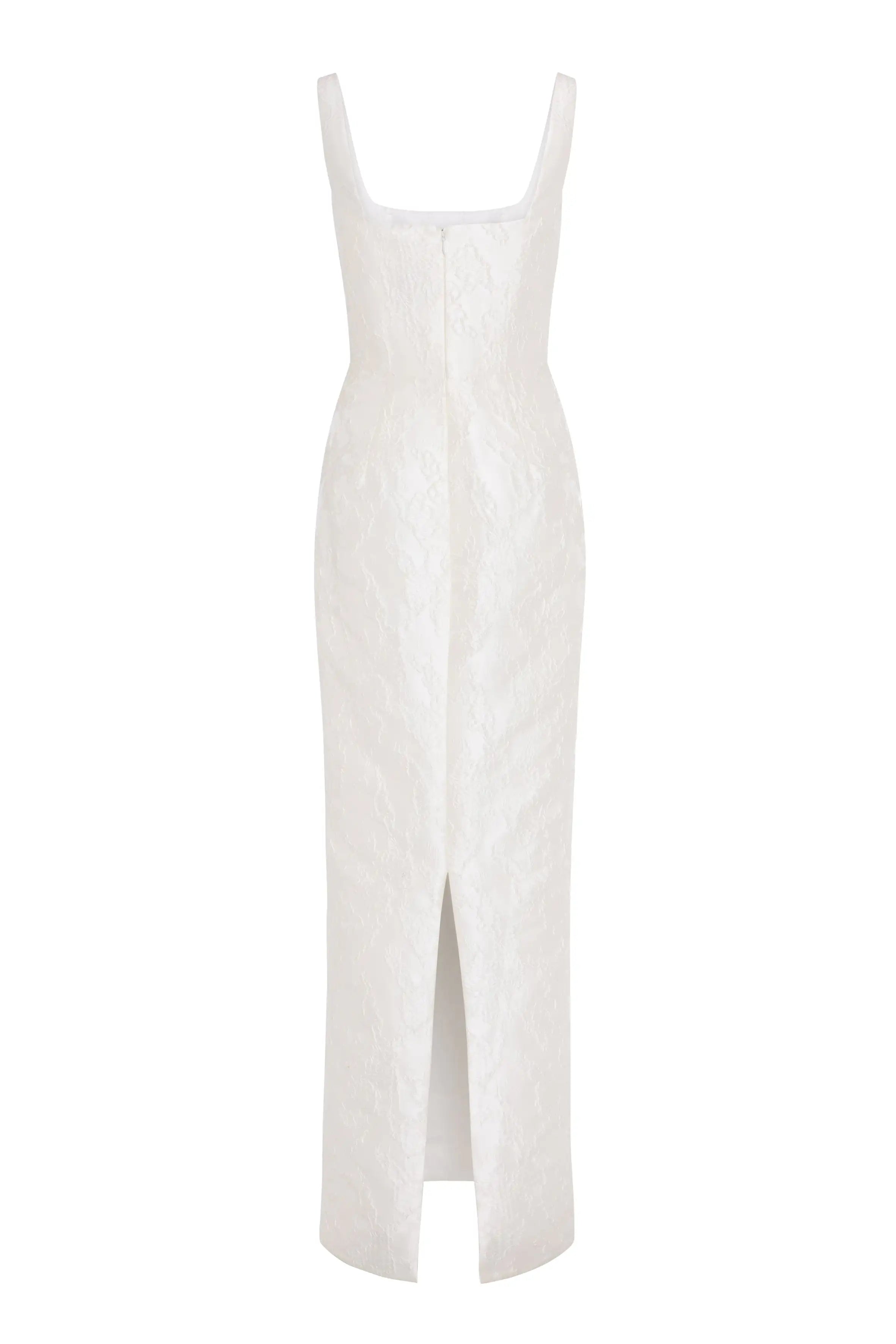 The Waldorf Bridal Dress in Vintage Ivory Brocade by TH&TH is a sleeveless, floor-length column gown with a square neckline, textured floral pattern, and front hem slit.