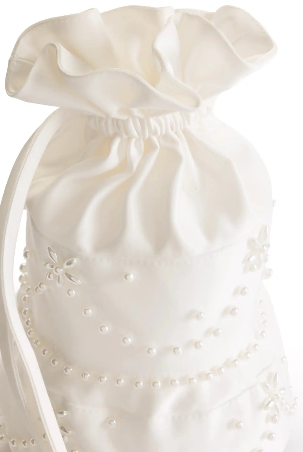 The 'Wedding Cake' Embellished Bag in Ivory by TH&TH features a ruffled top, pearl accents, and floral embroidery—an elegant bridal accessory for your special day.