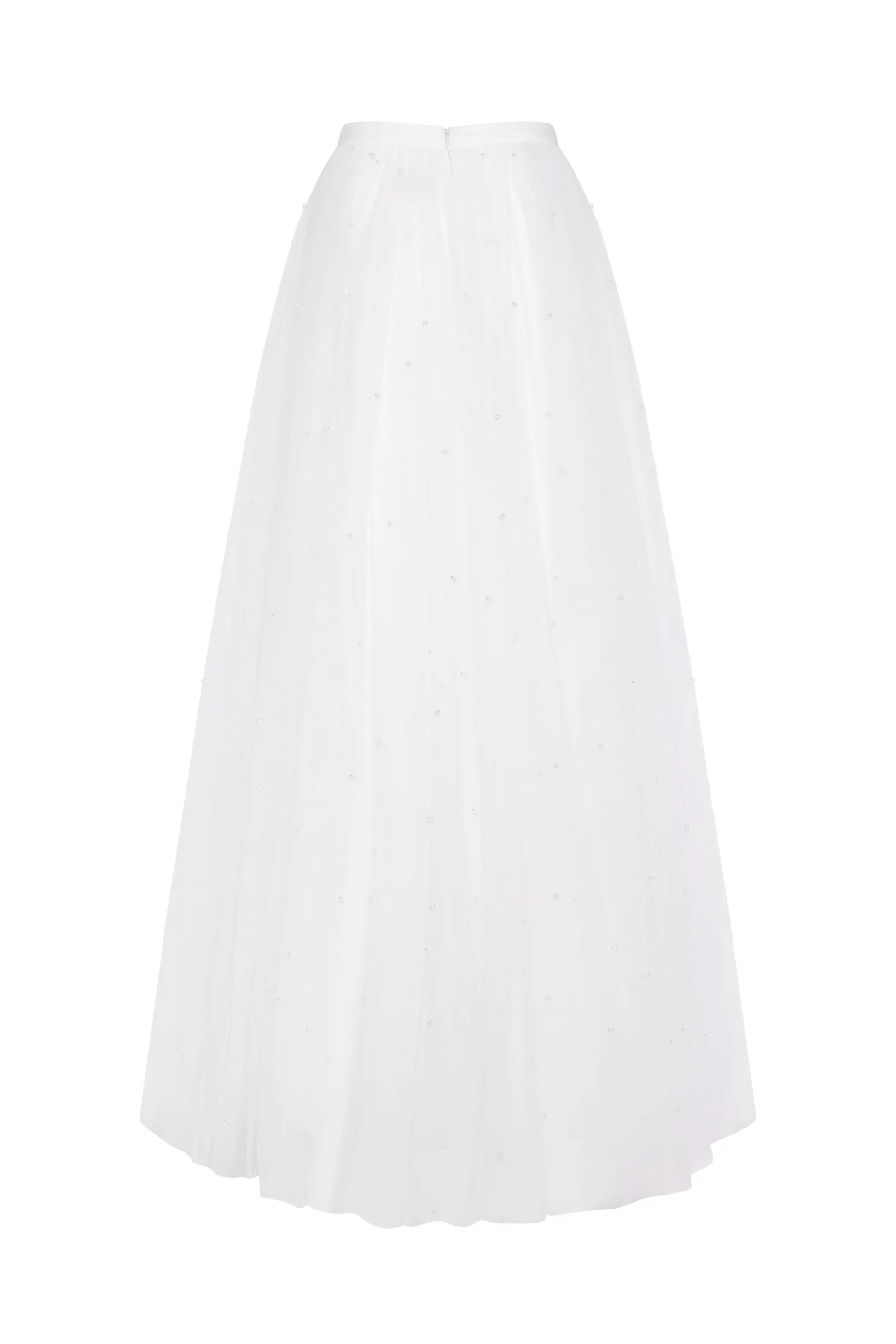 The Wyatt Bridal Skirt in Ivory Tulle by TH&TH features a high waist, flowing voluminous silhouette, sheer delicate fabric, and subtle pearl embellishments for an elegant bridal look.