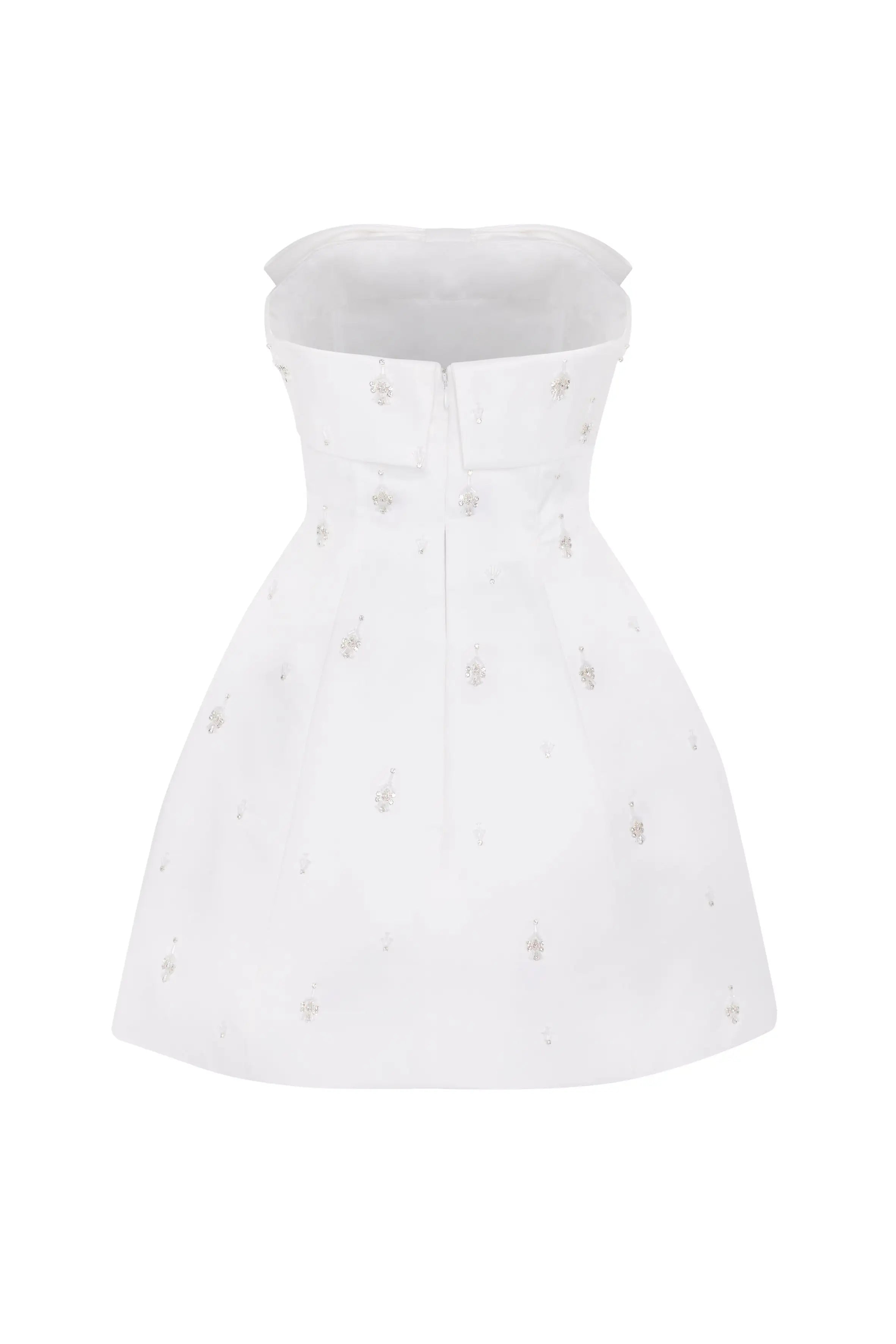 White strapless dress with pearl embellishments on a white background