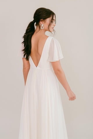 white bridesmaid dresses, model back view close up