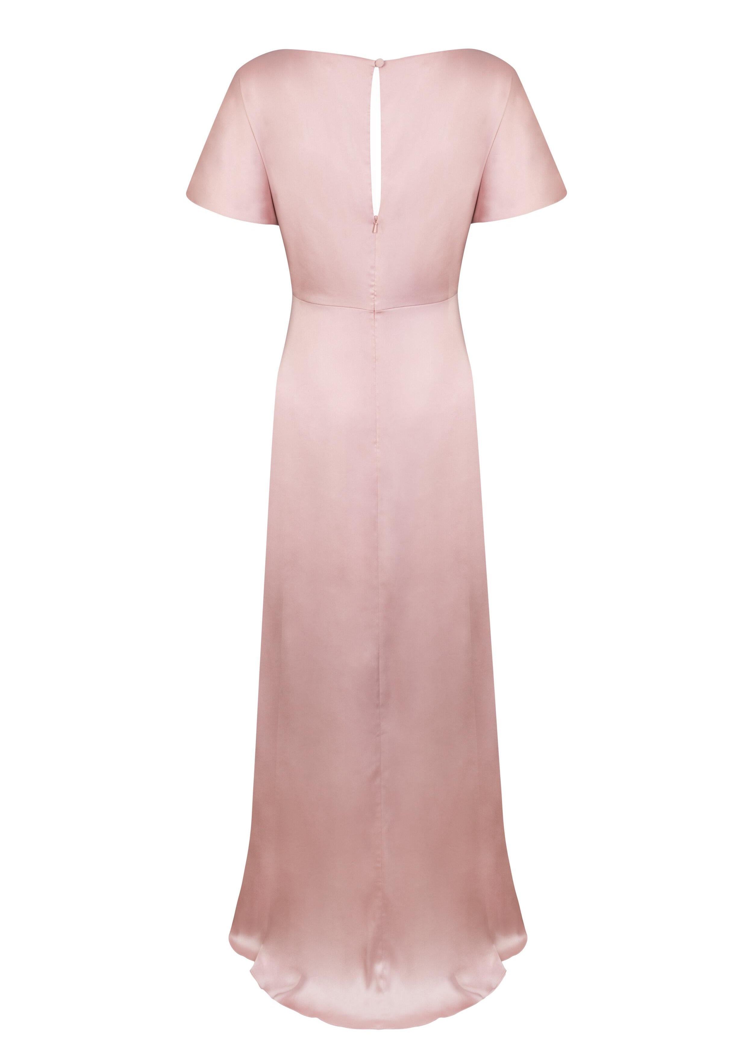 A blush pink satin bridesmaid dress with keyhole back opening, flutter sleeves on a white background by TH&TH Bridesmaids. 
